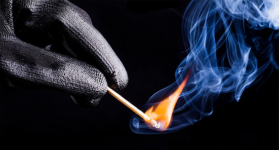 Gloved Hand Holding Lit Match, how can you reduce the risk of arson